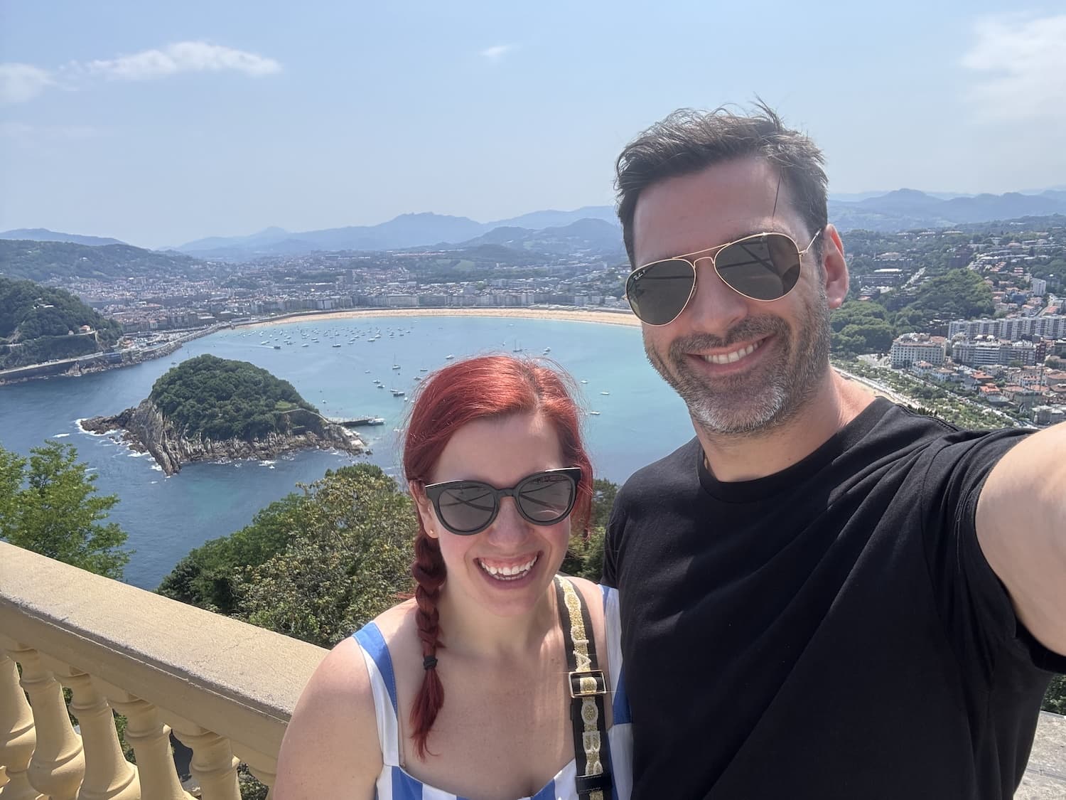Phil and Kelly with San Sebastián laid out behind them